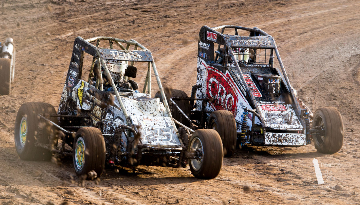 Racing Photos: #35 and #71 midget cars battling the mud