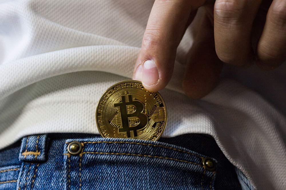While not a physical coin, Bitcoin is still a very valid form of paying for photography